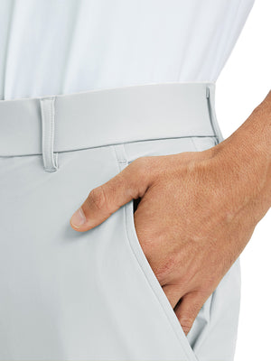 Close-up detail of one hand resting in pocket, showing relaxed fit of the glacier grey quick dry pants.