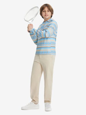 A full-body shot of a model wearing a youth full print stylish hoodie pullover in blue ethnic, playing tennis.