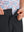 Detail: waistband of black boys lightweight dry fit flat front golf shorts