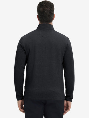 Back upper view of casual fleece lined quarter zip pullover in black, showing fit and seams.