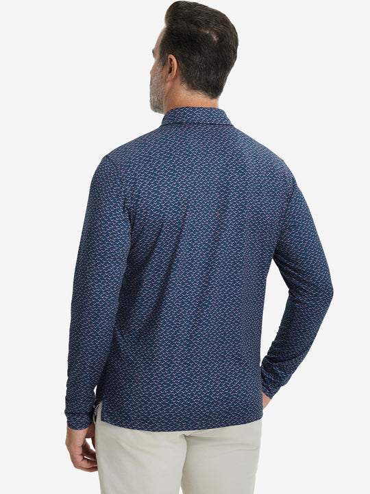 Back upper body view of the lightweight print polo in navy pink seagull, model turns slightly with relaxed pose.