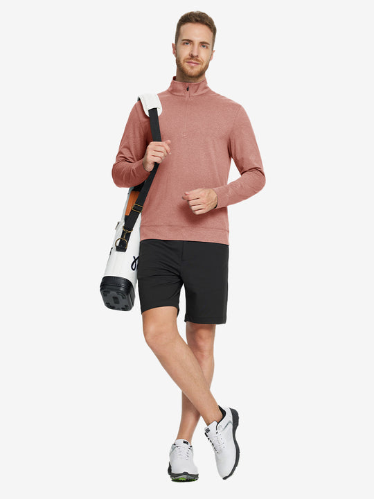 Full-body view of model carrying golf bag in quarter zip melange pullover brick melange.
