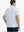 Back view of model wearing Bluish Violet Light Blue Performance Stripe Golf Shirt