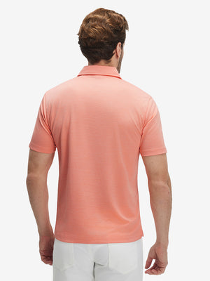 Back waist-up shot of model wearing orange red grid ultra-light quick dry moisture wicking collared polo shirt