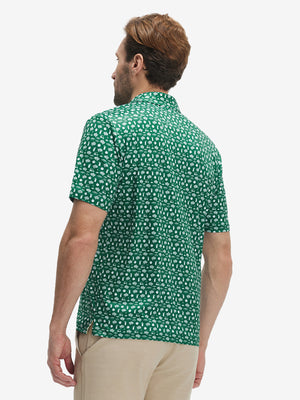 Back half-body view of model wearing the golf vacation 4 way stretch print collared polo shirt, highlighting the rear silhouette