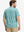 Back half-body of model in white green florals stretch printed collarless henley golf shirts