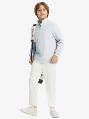 Full body model carrying a golf bag, wearing youth winter micro-fleece quarter zip pullover in misty grey