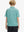 Back half-body view of boy wearing GREEN RUGBY Performance Print Boys Golf Polo outdoors