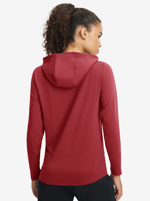 Back upper view of model in women's lightweight hoodies pullover, showing relaxed fit in red.