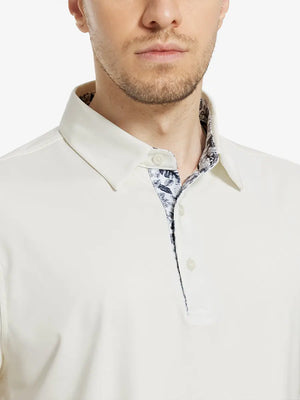 Male model wearing the Cream Everyday Classic Solid Polo, front view from nose to chest