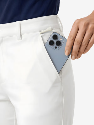 Detail view of front pocket on white women's regular fit stretchy golf pants