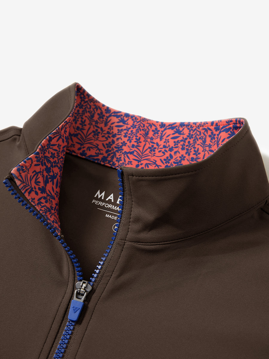 Collar zipper and inner neck pattern detail of the lightweight golf quarter zip pullover in coffee brown.