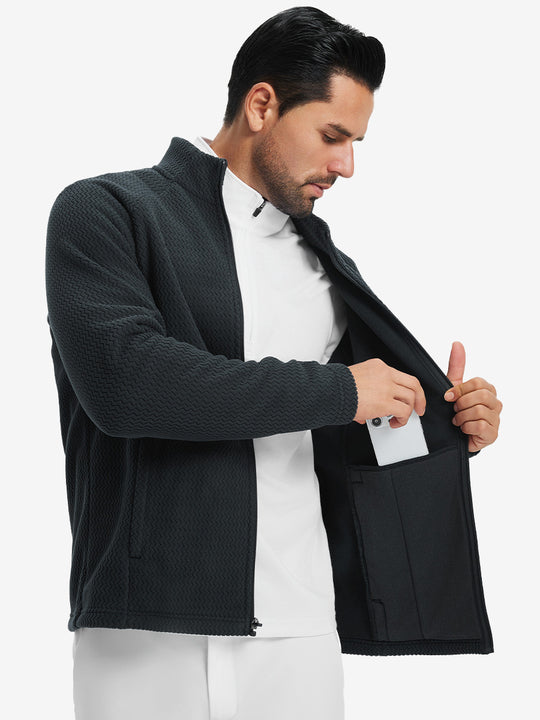 Model showing inner pocket of soft winter fleece jackets in black, fitting an iPhone inside.