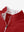 Zipper and inner pattern detail of the print collar quarter zip golf vest in red, highlighting design.
