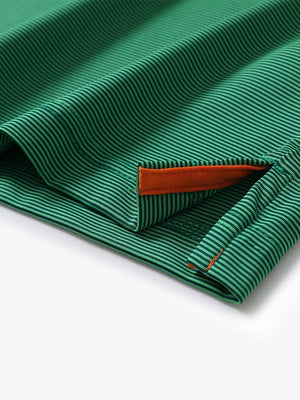 Hem detail of Long sleeve pinstripe jersey polo with neat finish in green stripe