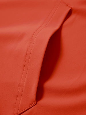 Close-up of single pocket detail on youth long sleeve hoodied with kangaroo pocket in orange, showing stitching.