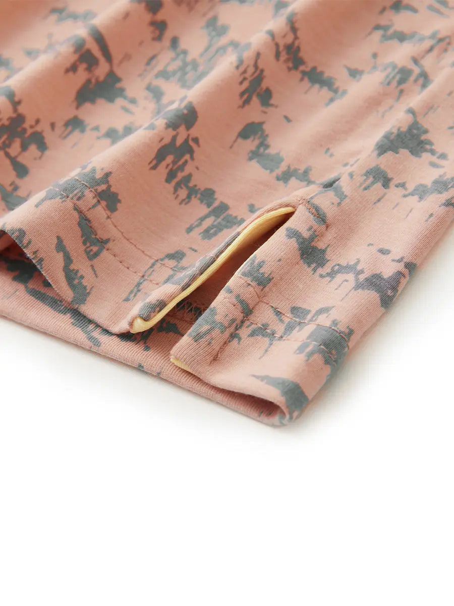 Hem slit detail of LIGHT ORANGE MASSIF Popular Heather Print Polo highlighting stitching and finish
