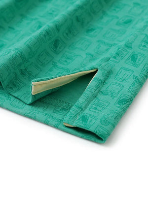 Hem slit detail of GREEN WHISKEY GLASS Popular Heather Print Polo highlighting stitching and finish