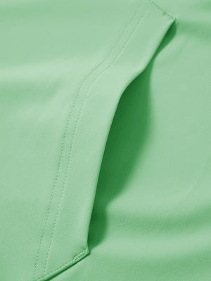 Close-up of single pocket detail on youth long sleeve hoodied with kangaroo pocket in light green, showing stitching.