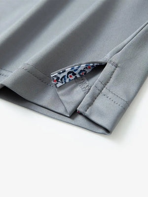 Close-up of side slit detail on the Light Grey Everyday Classic Solid Polo hem