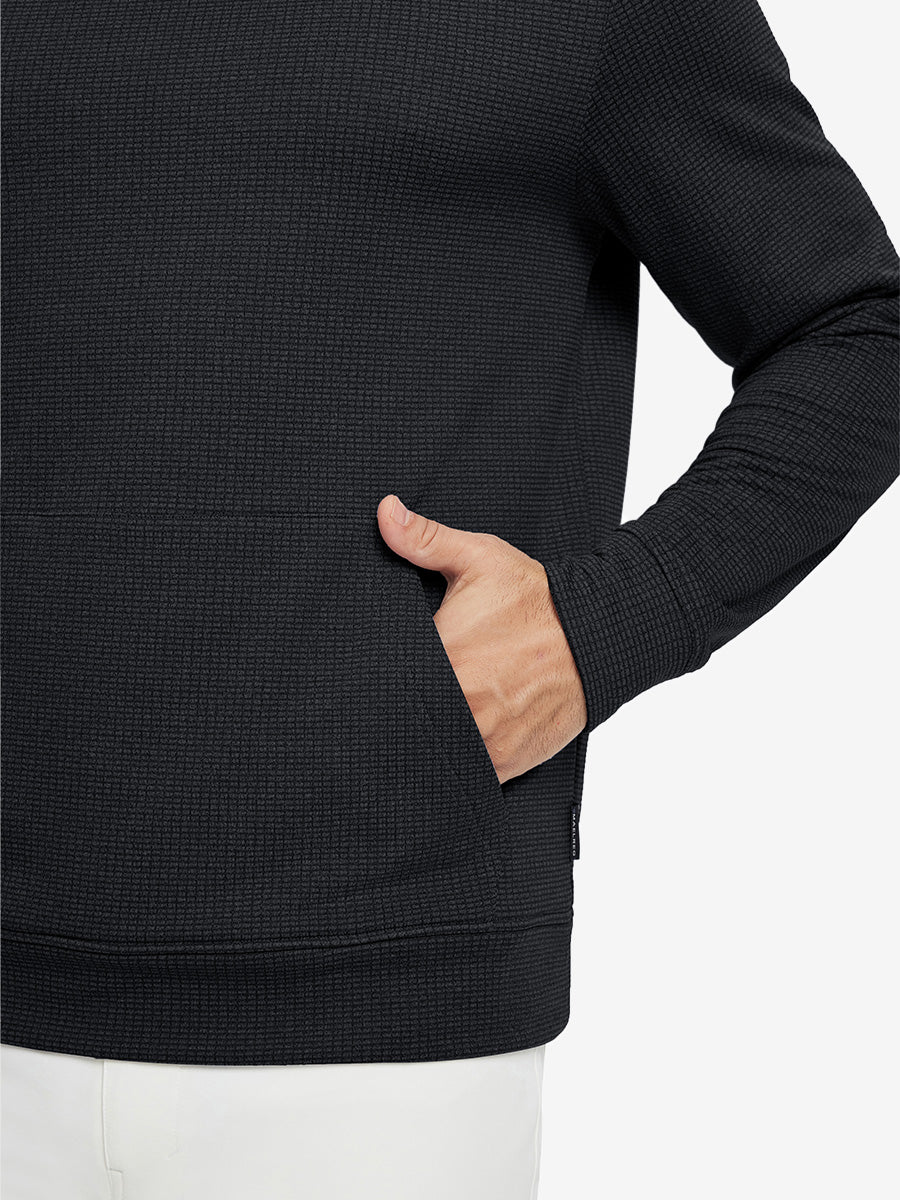 Close-up of model with both hands in pockets wearing warm fleece golf hoodies pullover  black.