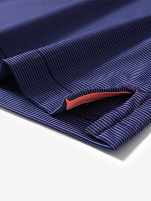 Hem detail of Long sleeve pinstripe jersey polo with neat finish in plum blue stripe