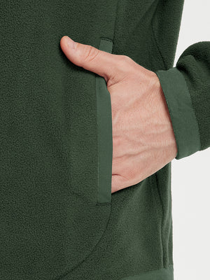 Hand in pocket detail of the Olive Green Quarter Zip Polar Fleece Sweatshirt, soft fleece fabric.