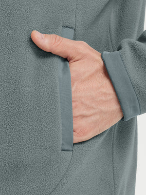 Hand in pocket detail of the Smoky Gray Quarter Zip Polar Fleece Sweatshirt, soft fleece fabric.