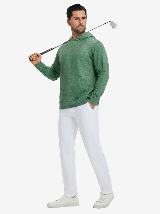 Full-body view of model in green exclusive print kangaroo hoodies holding a golf club outdoors.