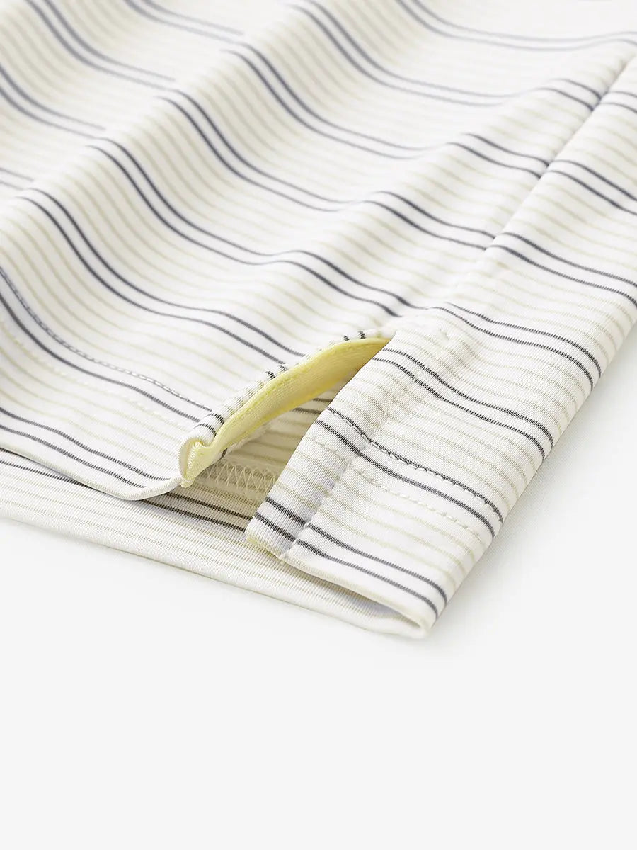Close-up of side hem slit on Khaki Neutral Grey Stripe Performance Stripe Golf Shirt