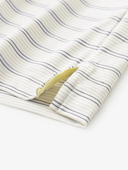 Close-up of side hem slit on Khaki Neutral Grey Stripe Performance Stripe Golf Shirt