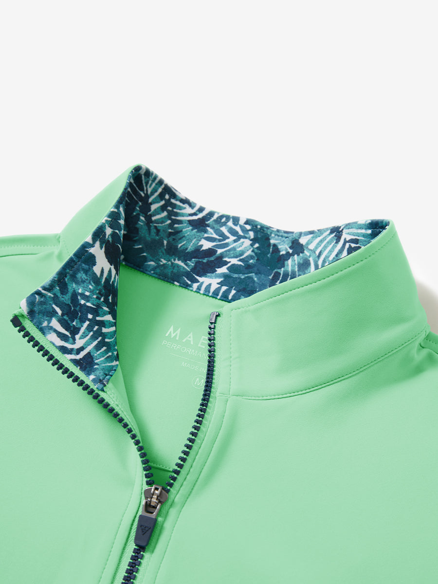 Collar zipper and inner neck pattern detail of the lightweight golf quarter zip pullover in light green.