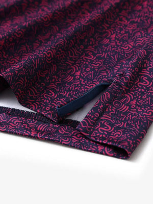 Hem slit detail of MAELREG Performance Jersey Print Polo in Navy Rose Abstract – comfort & movement
