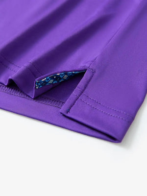 Close-up of side slit detail on the Purple Everyday Classic Solid Polo hem
