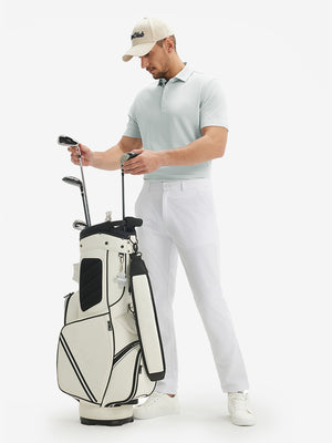 Full-body front view of model with a golf club wearing the silver gray ventilated pique performance polo on the course