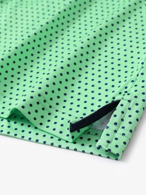 Hem slit detail of MAELREG Performance Jersey Print Polo in Green Navy Dot – comfort & movement