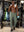 Full-body view of model in gym wearing OLIVE GREEN Performance Tapered Sports Joggers