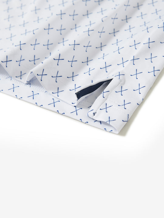 Hem slit detail of the white nav clue lightweight print long sleeve polo, showing fine stitching and finish.