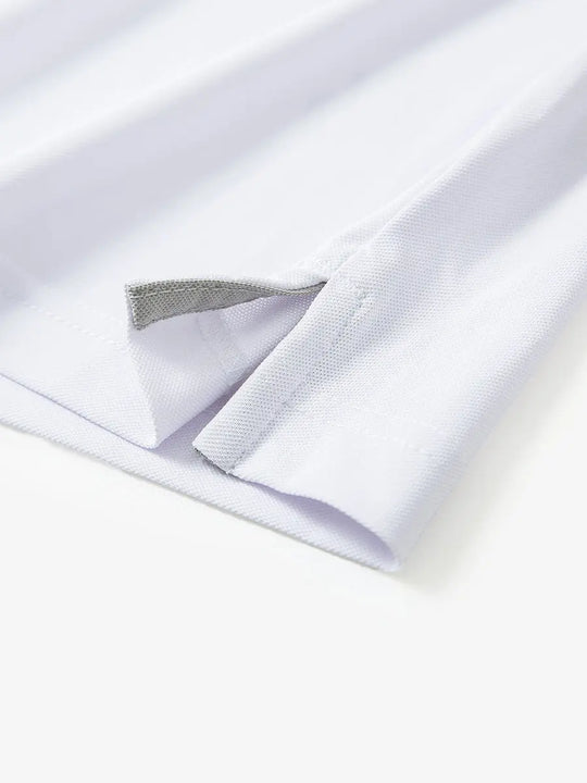 Detail shot of hem opening on WHITE Ventilated Pique Performance Polo