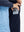 Close-up of the front side pocket detail on kids soft lightweight fleece lined jacket in navy, showing quality stitching.
