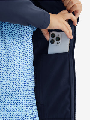 Close-up of the front side pocket detail on kids soft lightweight fleece lined jacket in navy, showing quality stitching.