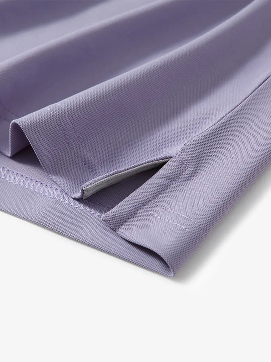 Detail shot of hem opening on LAVENDER Ventilated Pique Performance Polo