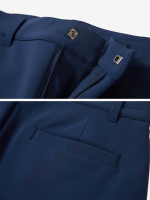 Close-up of the waistband details on navy water-resistant stretch heat-tech winter trousers