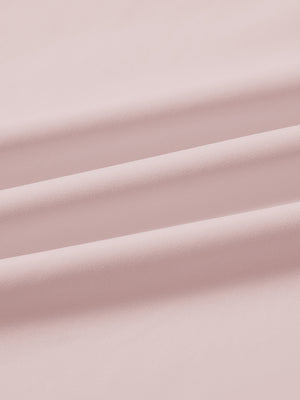 Close-up fabric detail of lightweight golf quarter zip pullover, smooth texture and breathable feel in light pink