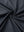 Close-up of blackdark grey premium performance polo fabric showing smooth texture.