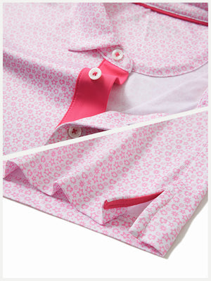 Hem detail of Performance quick dry print golf polos with neat stitching and white pink floral finish