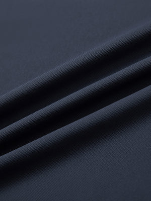 Fabric detail of Long sleeve performance solid pique polo with breathable knit in dark grey