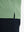 Detail shot of the hem on the spa green heather comfy cotton blend polo shirt with pocket, emphasizing the bottom edge design