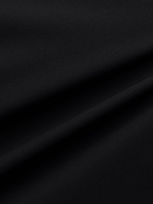 Close-up of black water resistant golf shorts fabric texture.