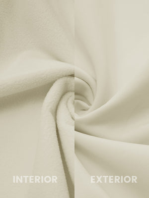 Close-up of light khaki softshell jacket showing water resistant outer shell and smooth inner lining.